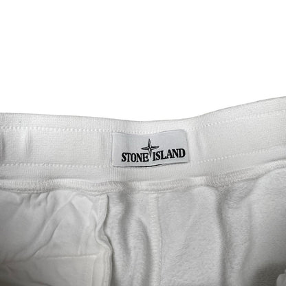Stone Island white jogger shorts with logo patch and cotton material.