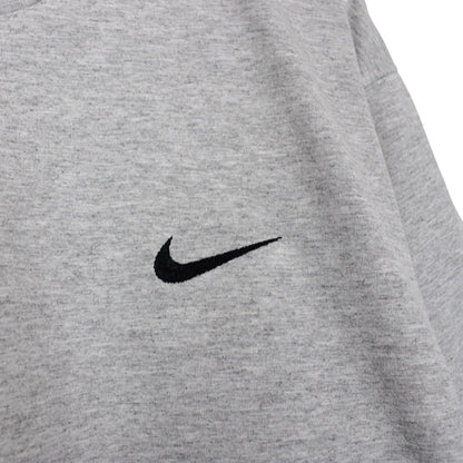 Nike grey short sleeve cotton t-shirt with pocket and vintage logo detail.