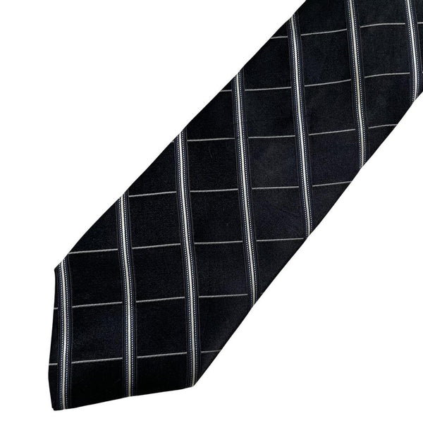 DKNY black silk tie with vintage striped pattern and logo detail.