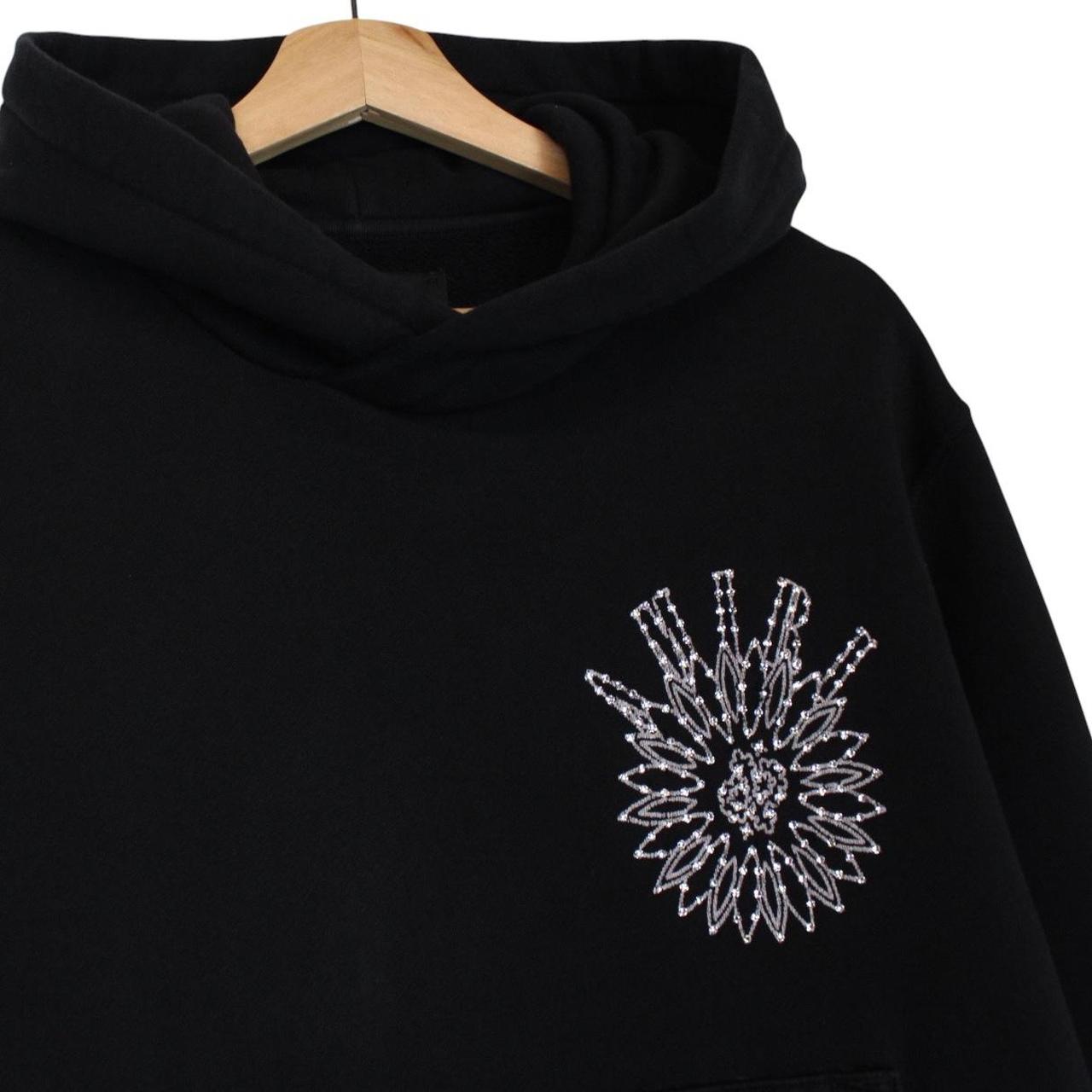 AMIRI black hoodie with rhinestone embellishments and crystal stick poke details.