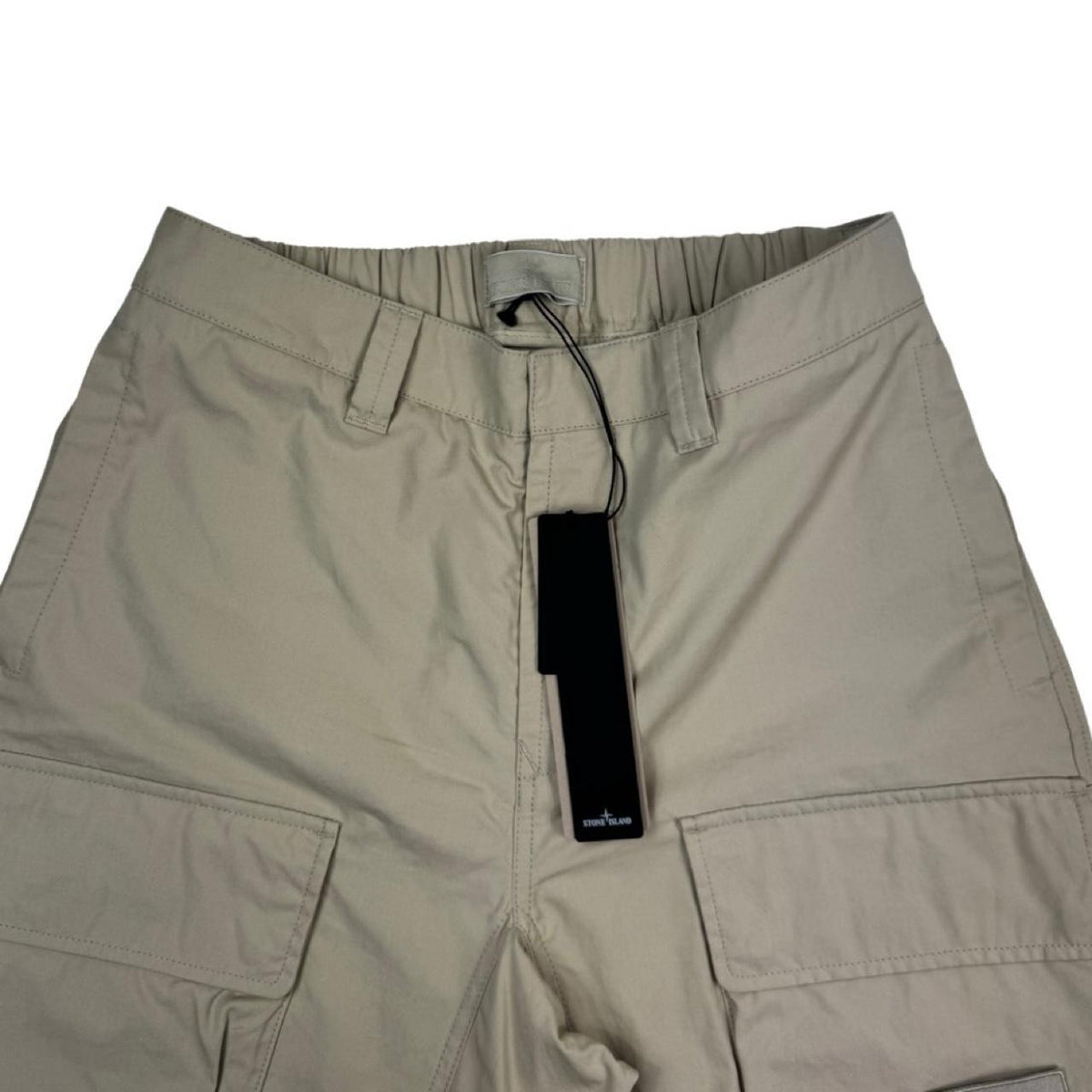 Stone Island beige cargo trousers with logo patch and multiple pockets.