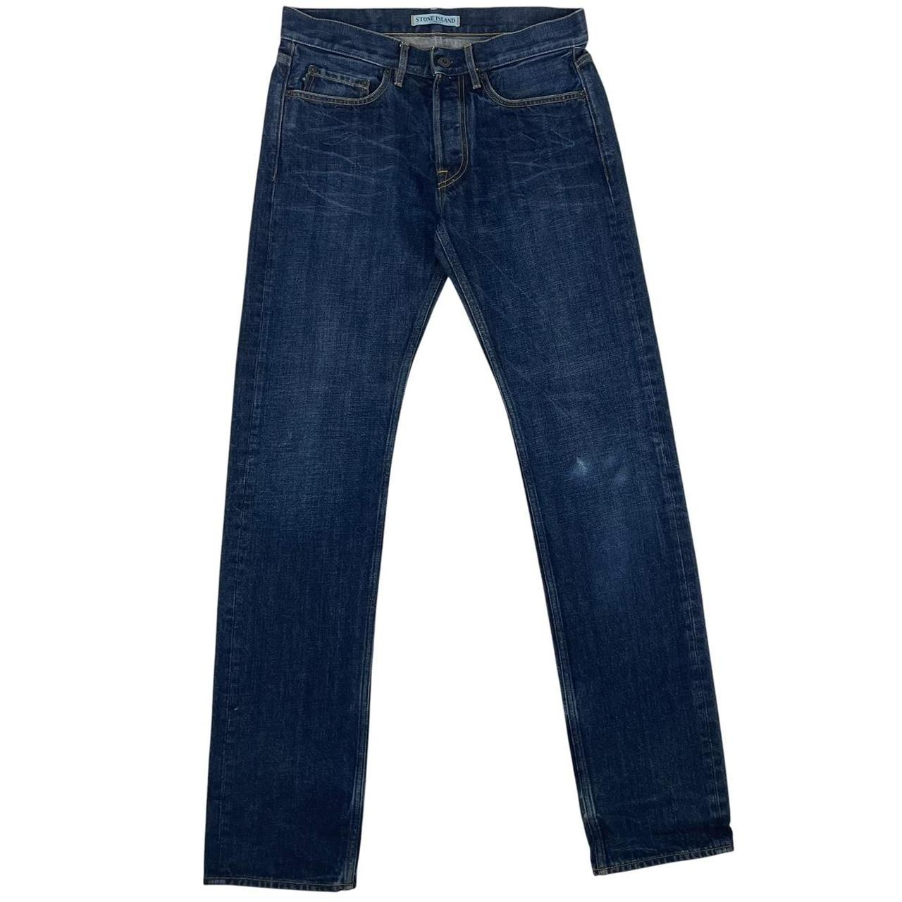 Stone Island navy blue straight jeans with logo patch and visible scuff on left knee.