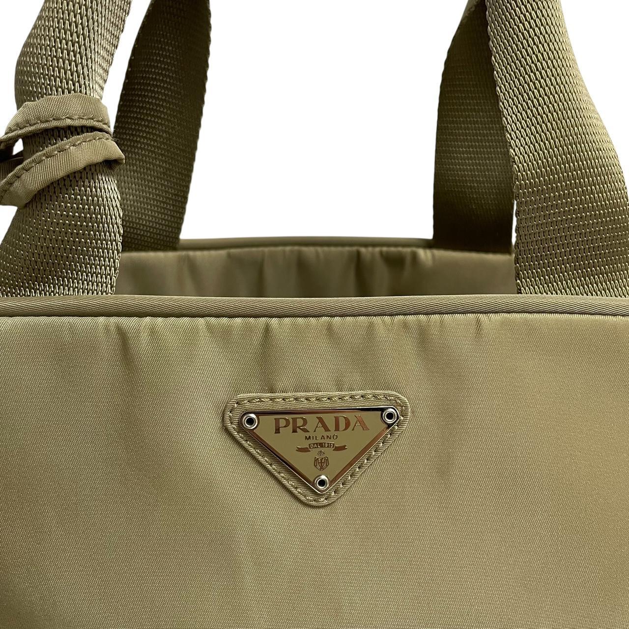 Prada green nylon duffel bag with logo detail and working lock and key.