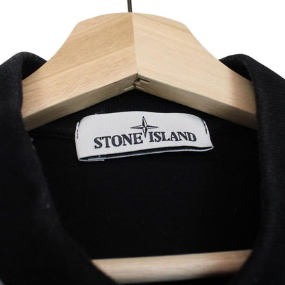 Stone Island black polo shirt with embroidered compass logo and cotton material.