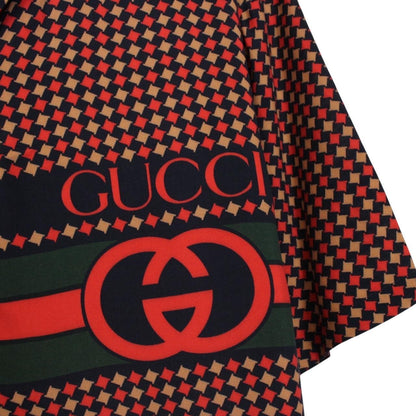 Gucci silk short sleeve bowling shirt in red and navy blue houndstooth pattern.