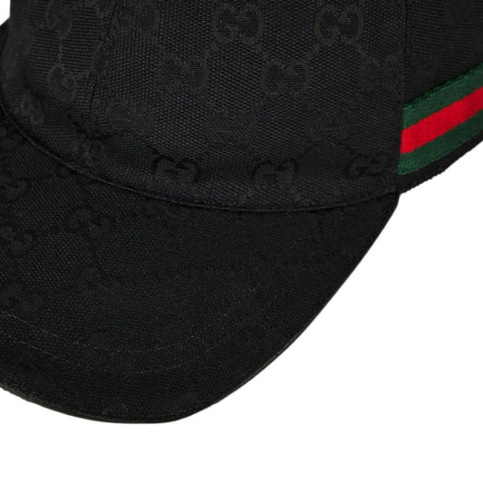 Brand New black apparel with green and red accents, includes dust bag and box.