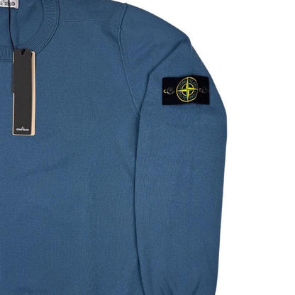 Stone Island blue organic cotton knit jumper with logo patch and ribbed cuffs.
