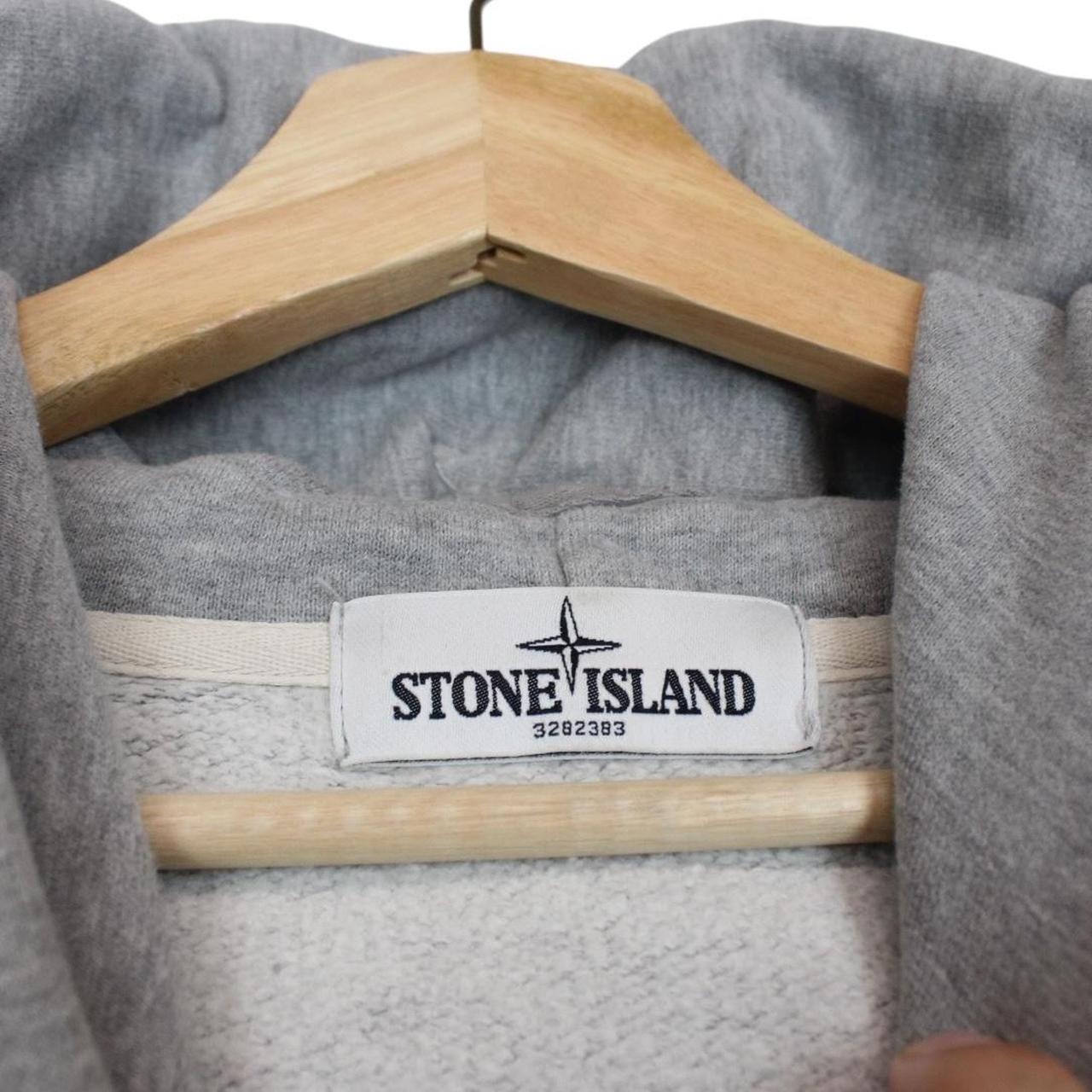 Stone Island grey cotton hoodie with logo patch and slight discolouration on sleeve.