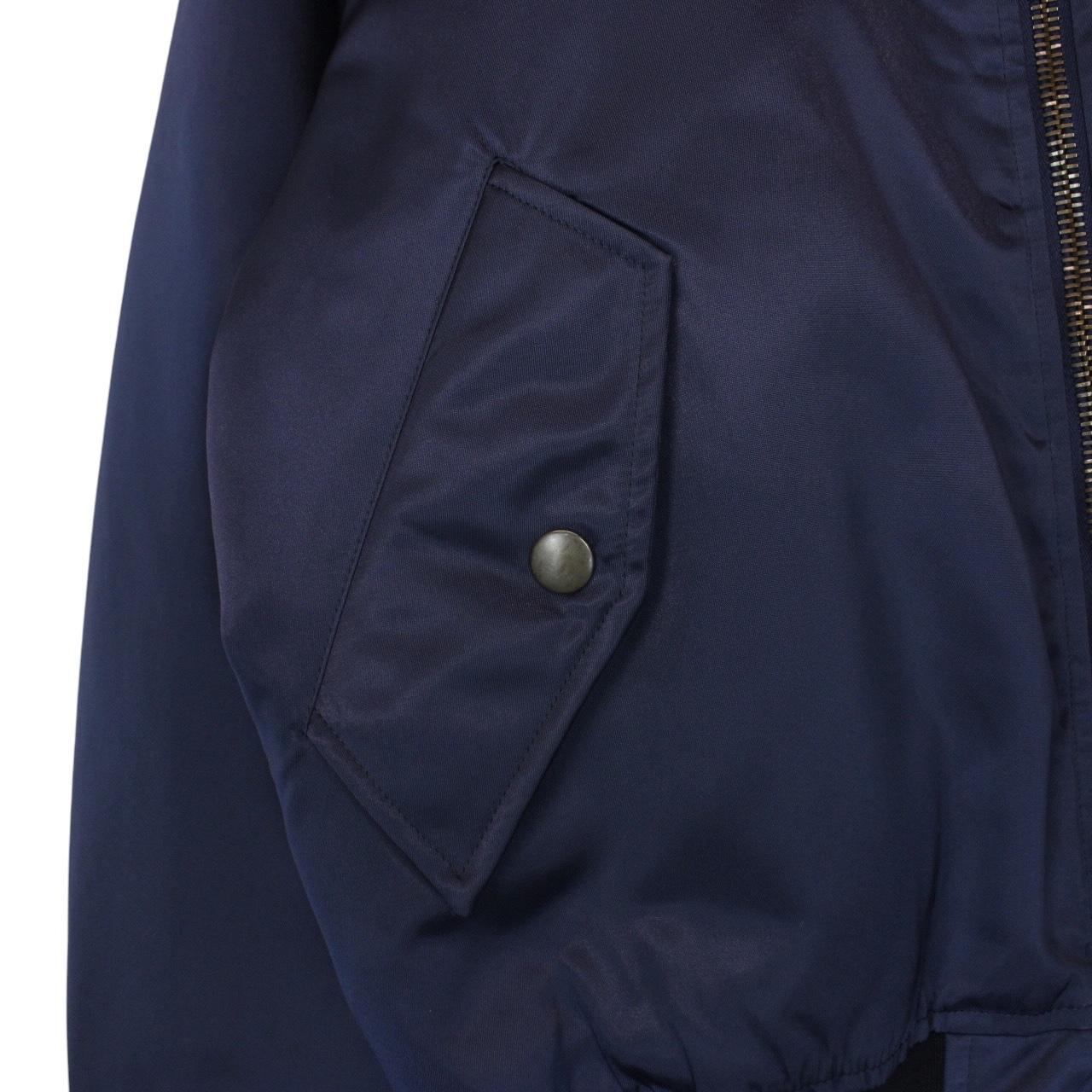 Balenciaga navy bomber jacket with full zip and campaign logo on chest.