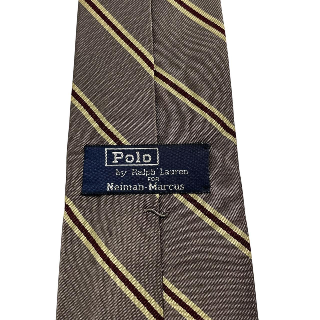 Polo Ralph Lauren grey silk tie with Neiman Marcus label and smooth texture.