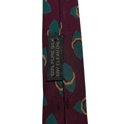 Giorgio Armani burgundy silk tie with geometric print and logo detail.