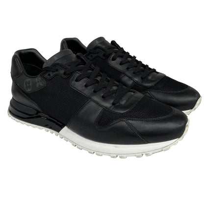 Louis Vuitton black trainers featuring monogram pattern and leather-mesh material.