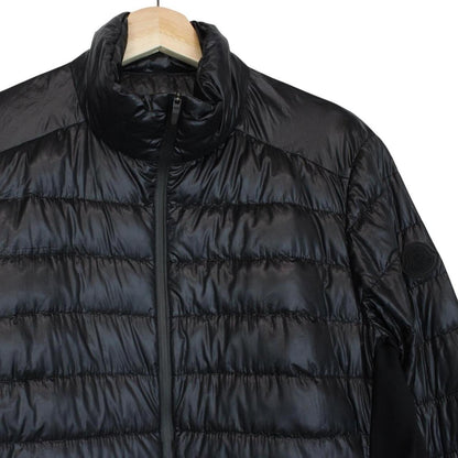 Moncler black lightweight down jacket with full zip and logo patch on sleeve.