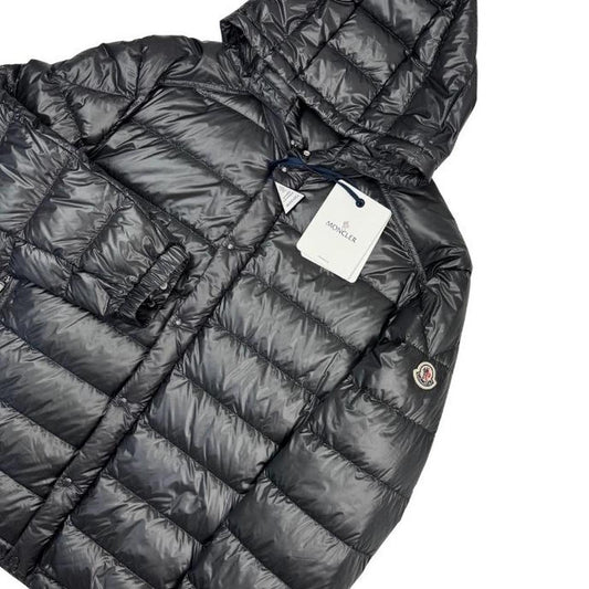 Moncler grey down nylon hooded puffer jacket with logo patch and quilted design.