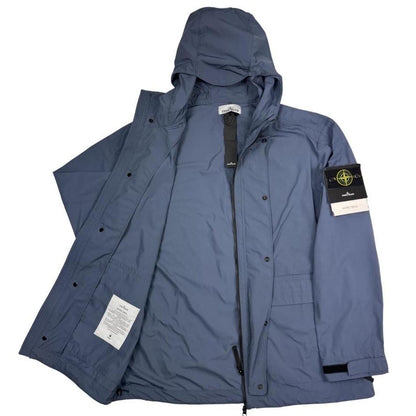 Stone Island blue hooded jacket with logo patch and micro twill fabric.