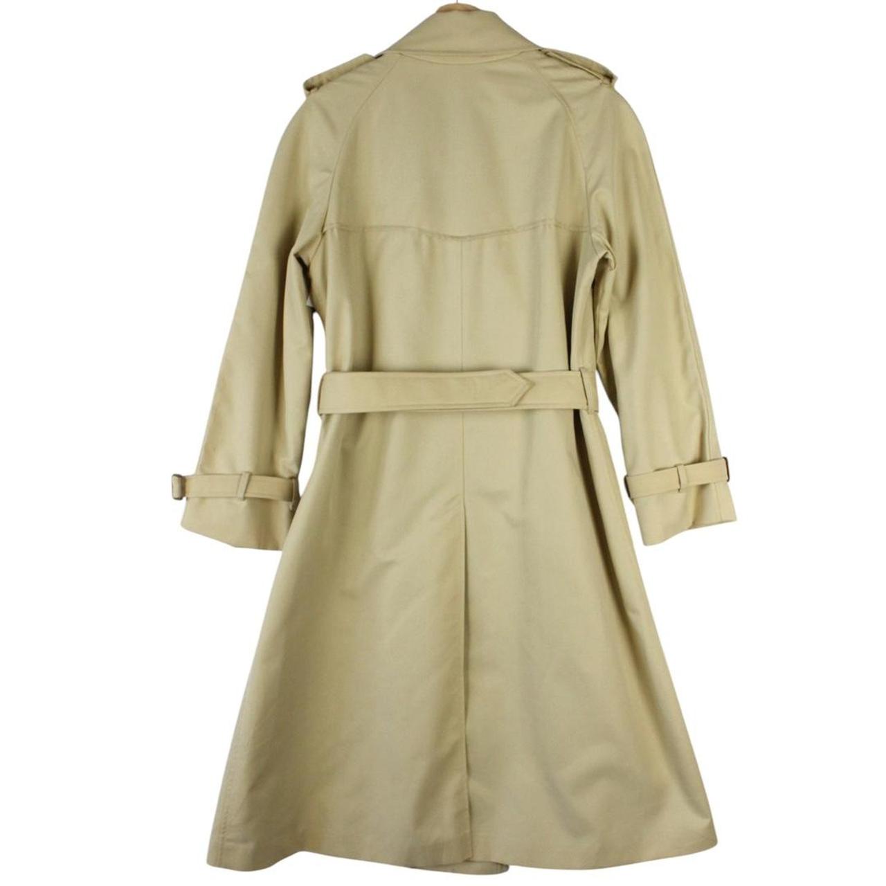 Burberry beige trench coat with Nova Check pattern, double-breasted and belted design.