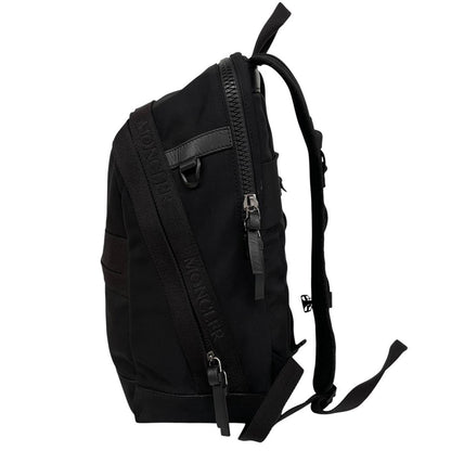 Moncler black duffel bag with logo patch and durable material, pre-loved condition.