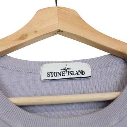 Stone Island lilac purple sweatshirt with compass logo patch and cotton material.