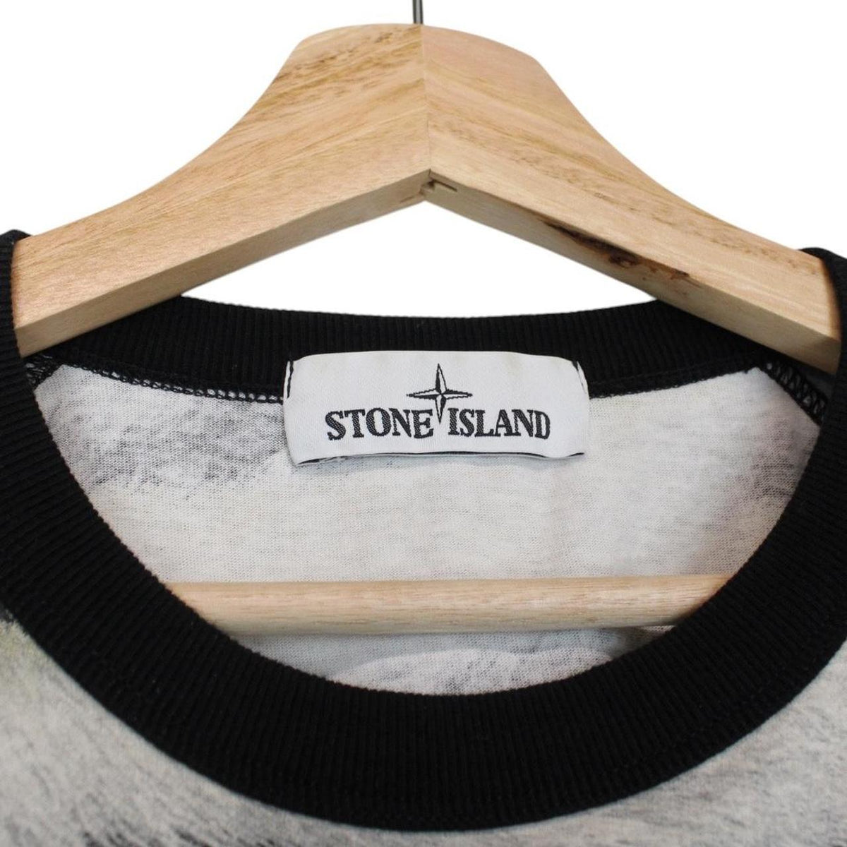 Stone Island short sleeve t-shirt in tiger camo pattern with logo patch on sleeve.