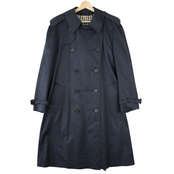 Aquascutum navy blue double breasted trench coat with house check pattern and logo.