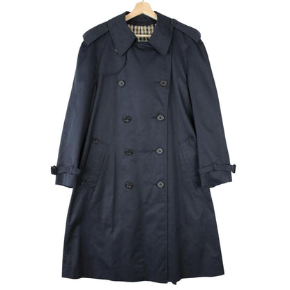 Aquascutum navy blue double breasted trench coat with house check pattern and logo.
