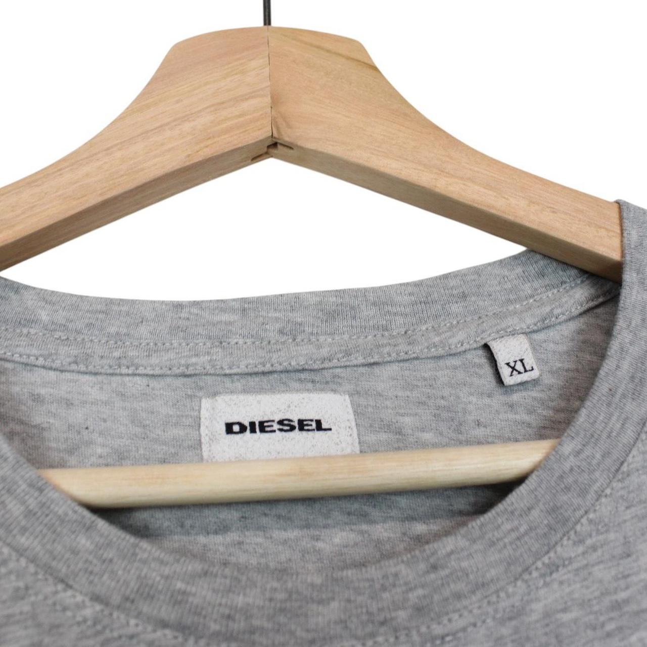 Diesel grey short sleeve cotton t-shirt with jaguar print and pocket detail.