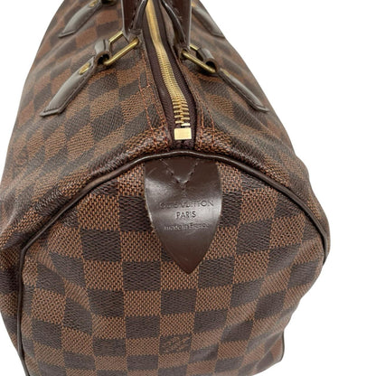 Louis Vuitton brown Damier Ebene canvas handbag with gold hardware and padlock detail.