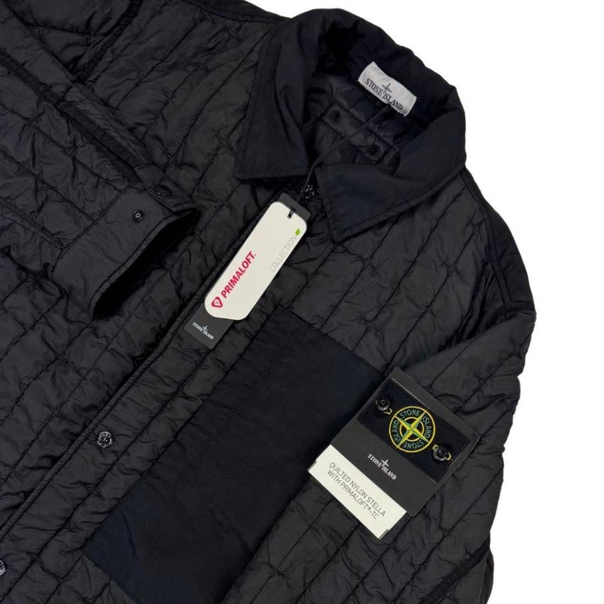 Stone Island black quilted nylon jacket with logo badge and Primaloft-TC material.