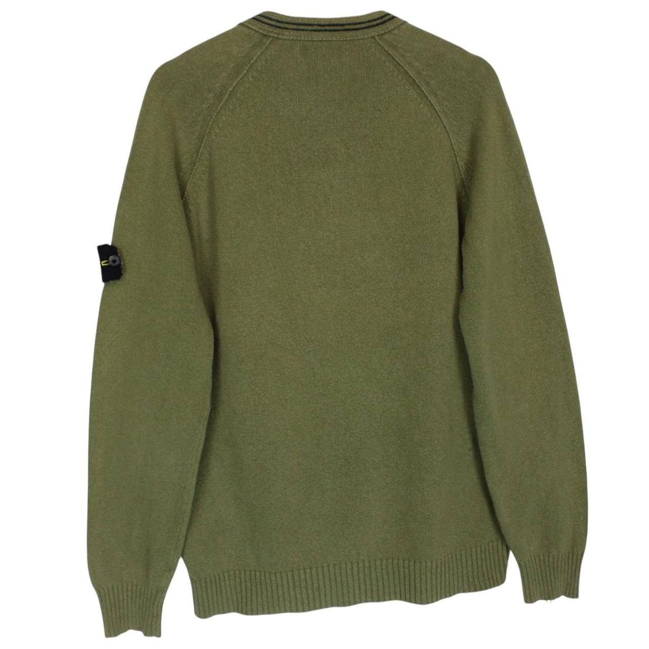 Stone Island green v-neck cotton knit jumper with logo patch and visible wear.