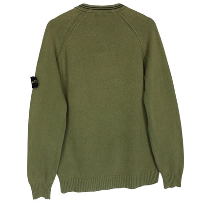 Stone Island green v-neck cotton knit jumper with logo patch and visible wear.
