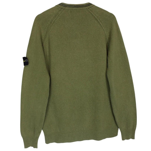 Stone Island green v-neck cotton knit jumper with logo patch and visible wear.
