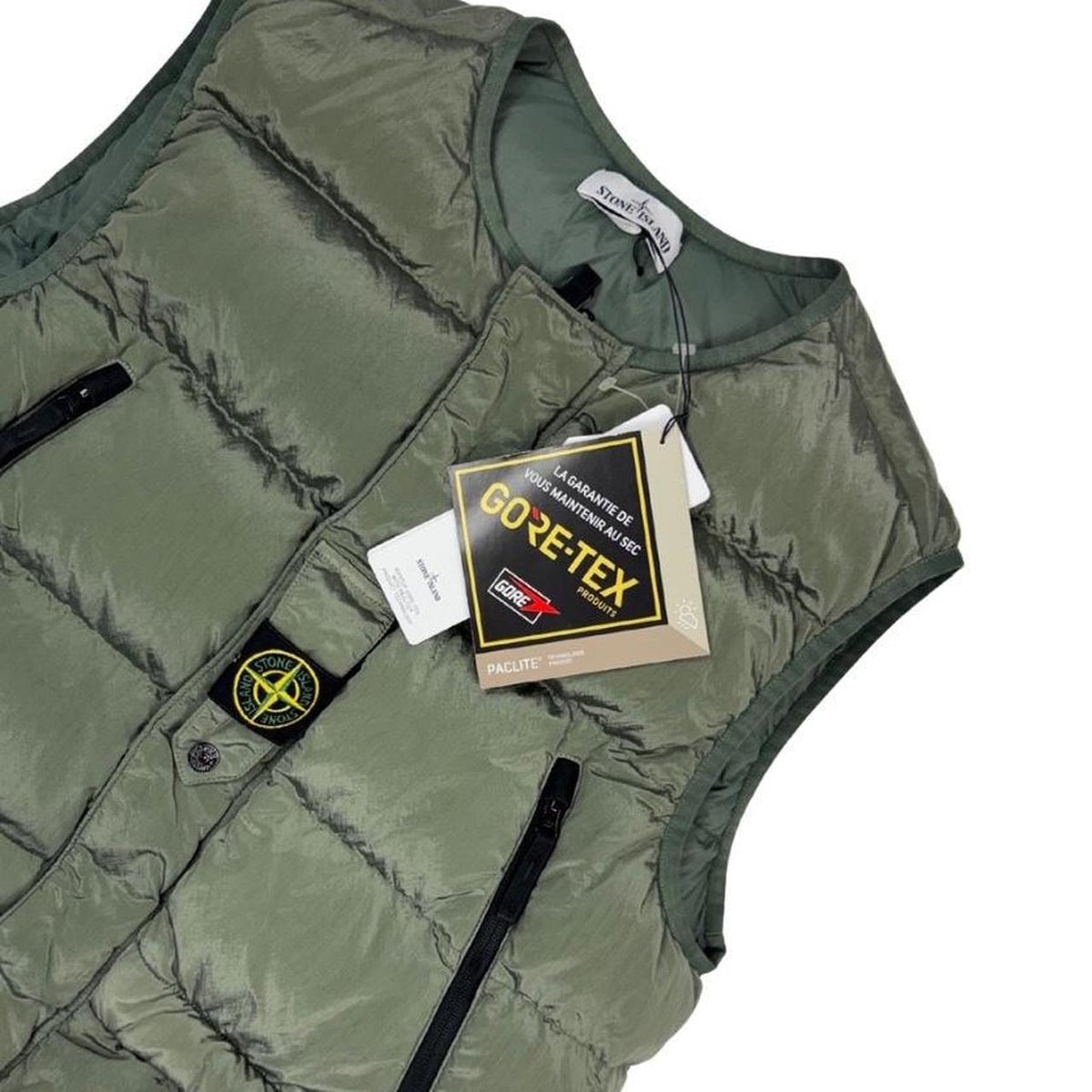 Stone Island black quilted gilet with Gore-Tex logo and ripstop material.