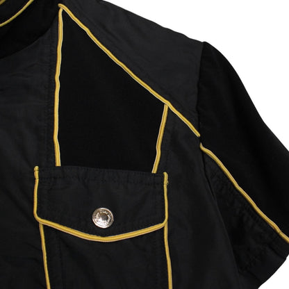 Christian Dior black and yellow jacket with 'Remove Before Flight' graphic detail.