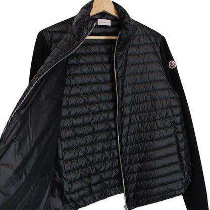 Moncler black cardigan jacket with full zip, down tricot material, and logo detail.