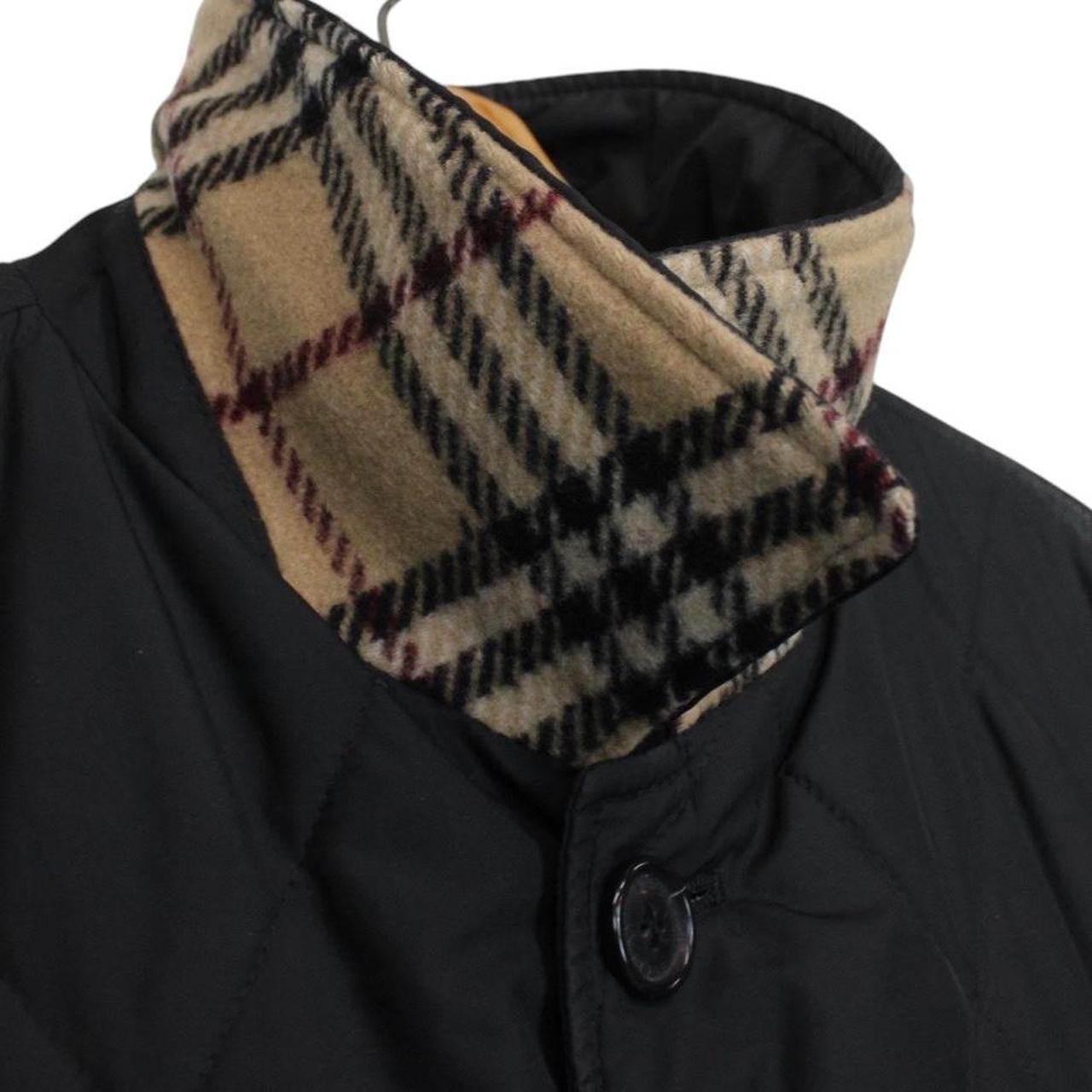 Burberry black coat with Nova Check lining and diamond quilted pattern.
