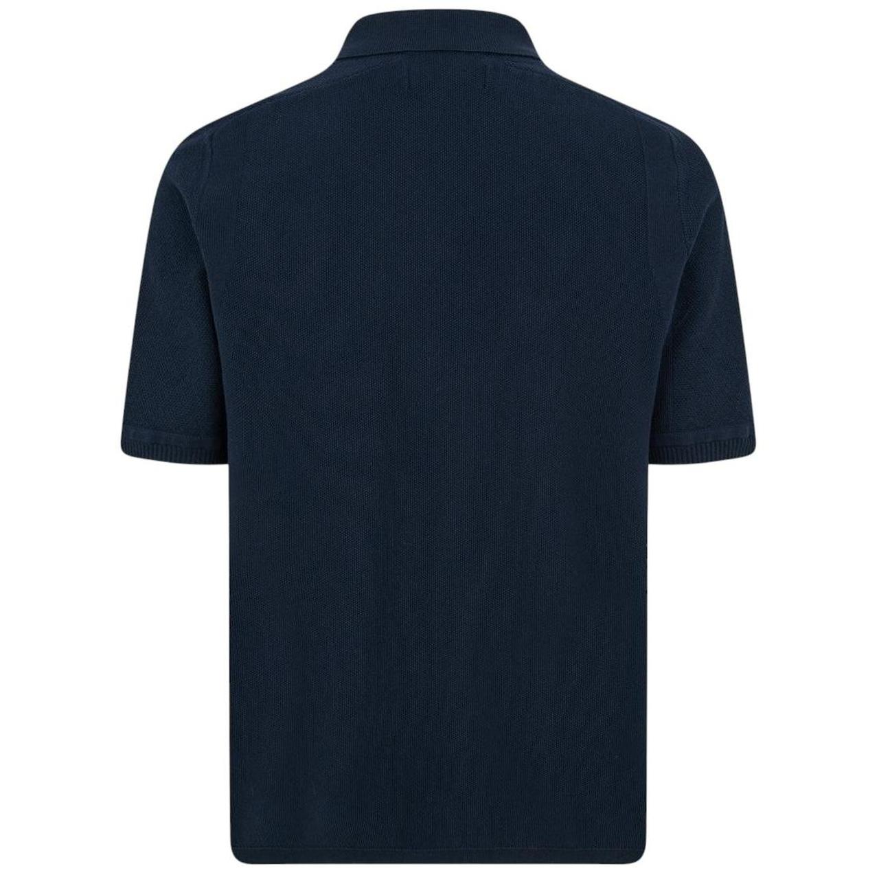 Stone Island navy blue polo shirt with Compass patch and three-button placket.
