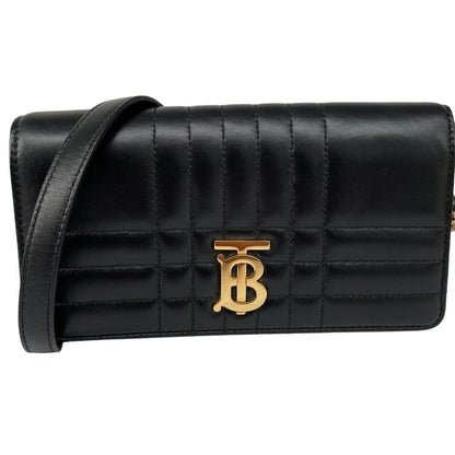 Burberry black and gold quilted leather small Lola shoulder bag with logo detail.