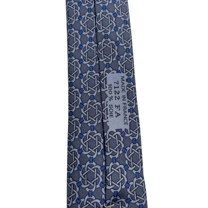 Hermes blue silk tie with geometric print and logo detail.
