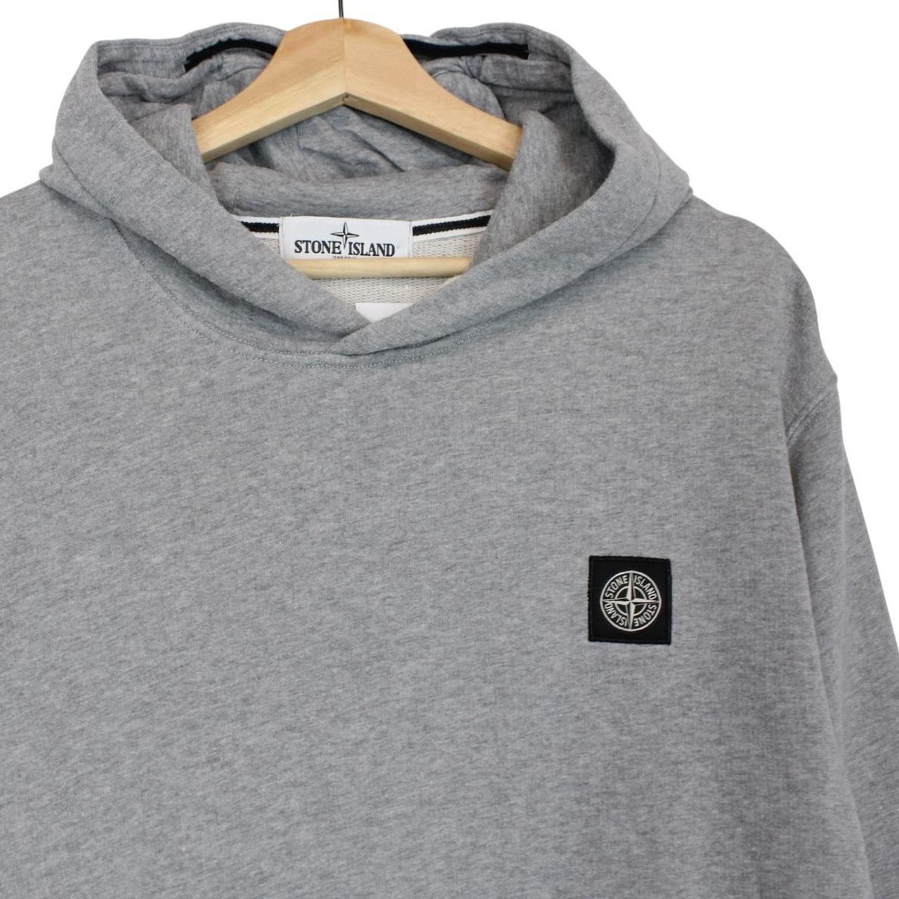Stone Island grey cotton hoodie with iconic compass logo and drawstring hood.
