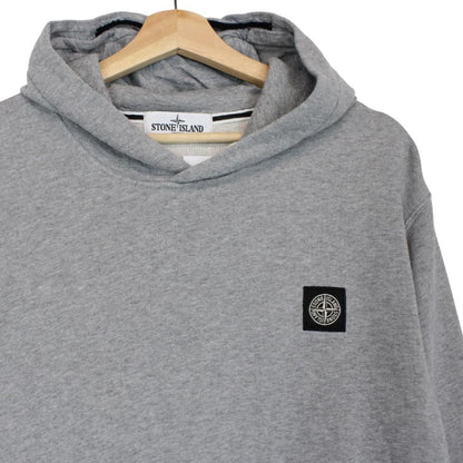 Stone Island grey cotton hoodie with iconic compass logo and drawstring hood.