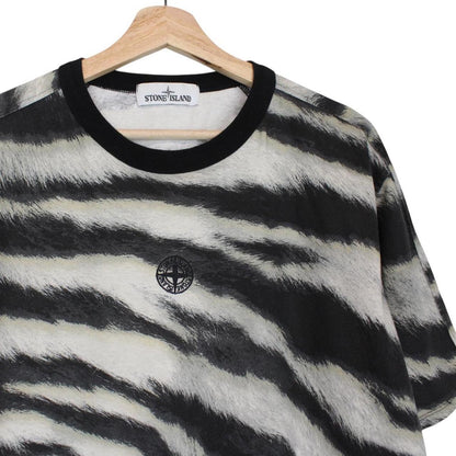 Stone Island short sleeve t-shirt in tiger camo pattern with logo patch on sleeve.