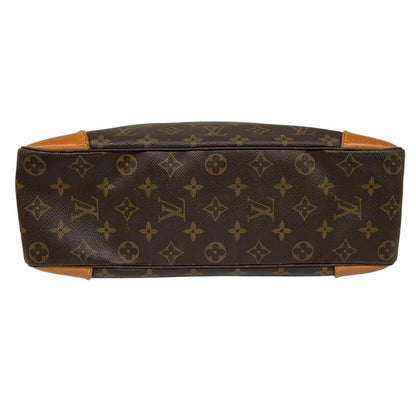 Louis Vuitton brown and tan monogram canvas duffel bag with leather accents and logo.