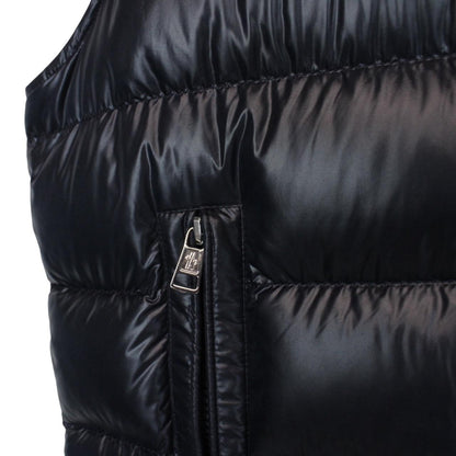 Moncler navy blue hooded nylon down gilet with logo and quilted texture.