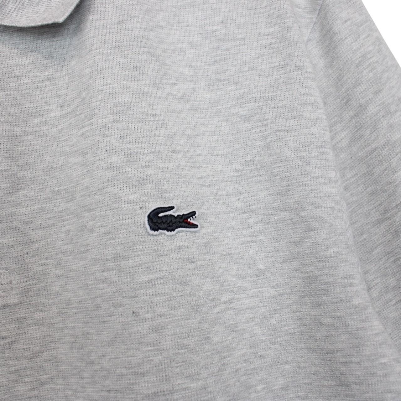 Lacoste grey short sleeve cotton polo shirt with embroidered crocodile logo.