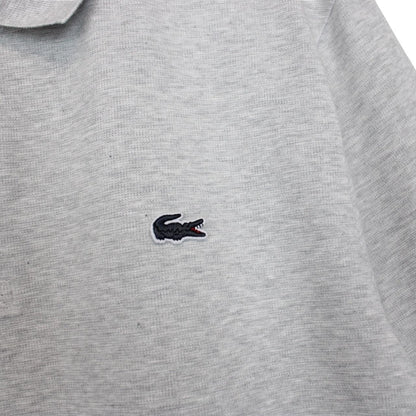Lacoste grey short sleeve cotton polo shirt with embroidered crocodile logo.