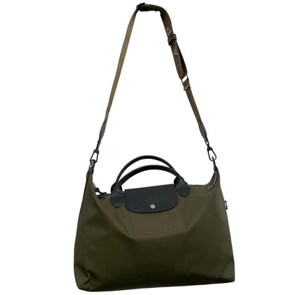 Longchamp green Le Pliage Enery tote bag with logo and durable nylon material.