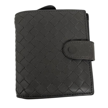 Bottega Veneta grey bifold wallet with Intrecciato woven leather pattern and popper closure.