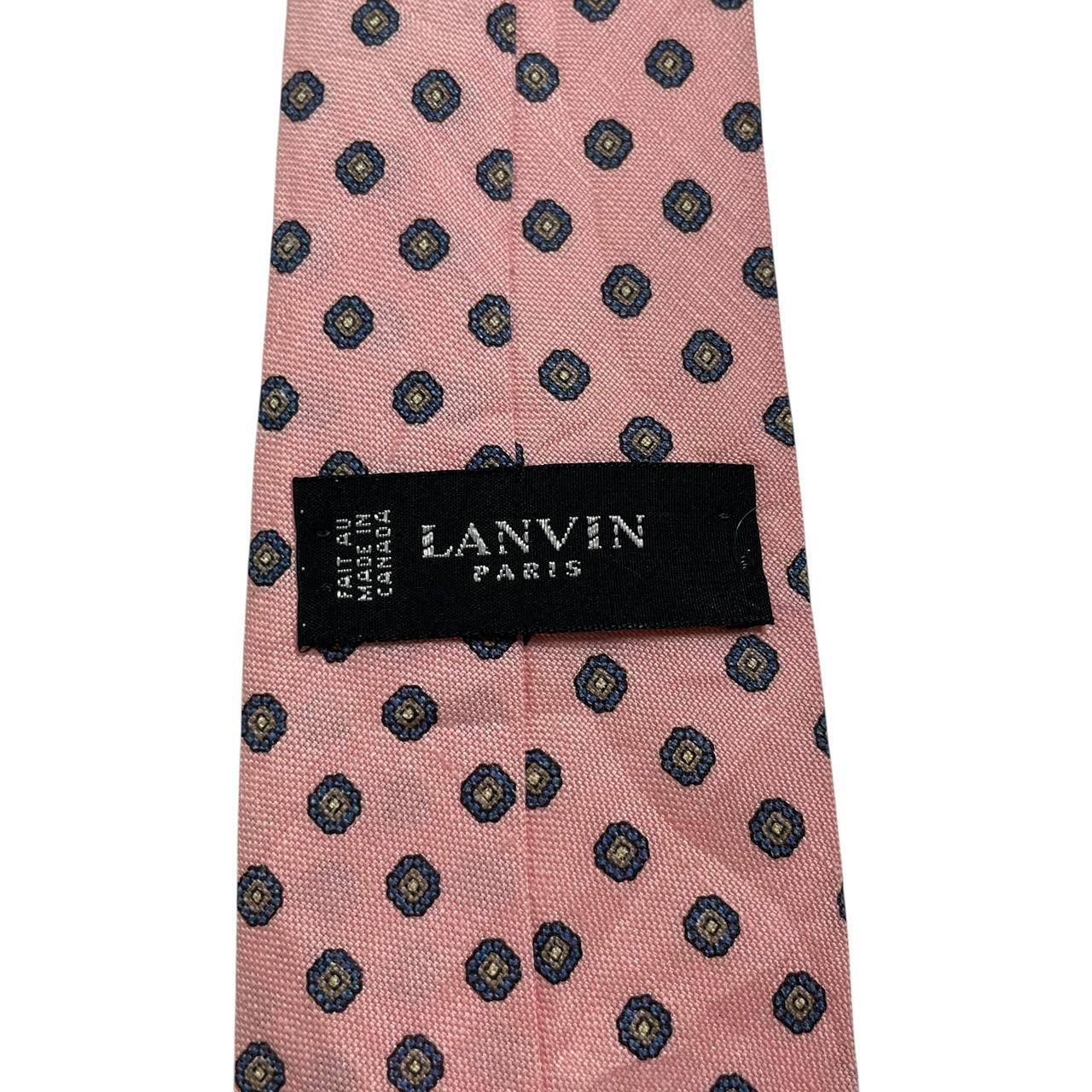 Lanvin pink silk tie with geometric print and logo detail.