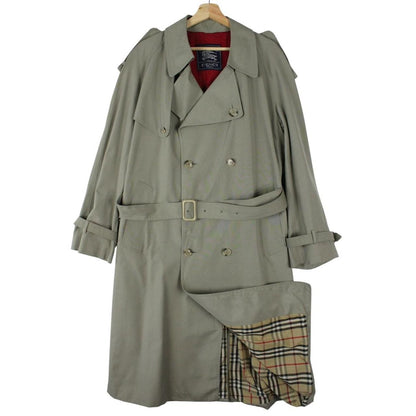 Burberry khaki green trench coat with Nova Check pattern and double-breasted design.