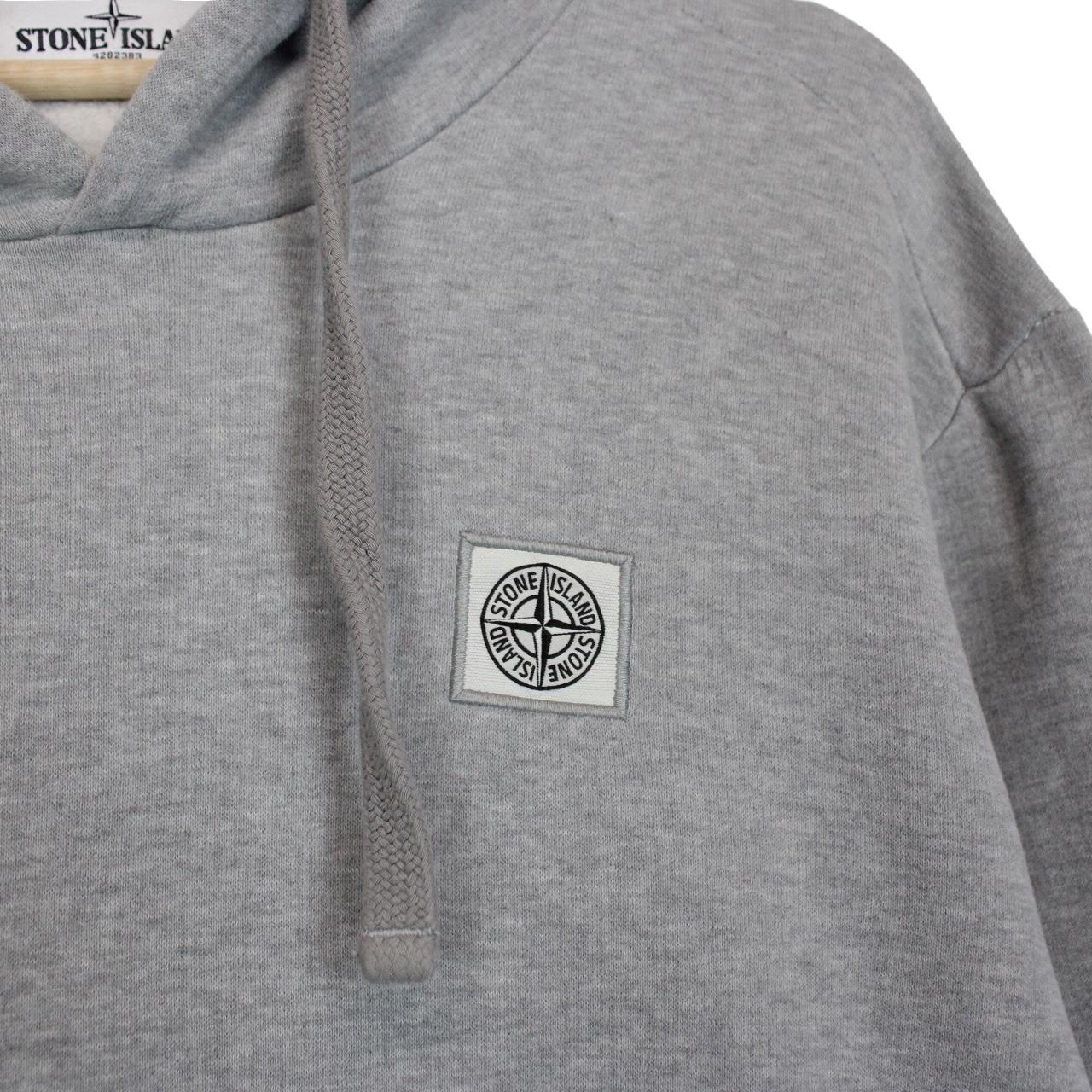 Stone Island grey cotton hoodie with logo patch and slight discolouration on sleeve.